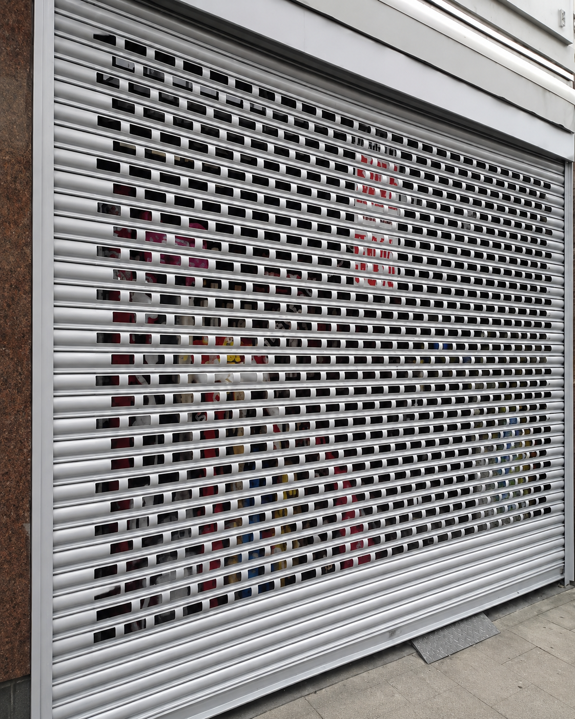 Mesh shutter guide rail, bottom rail, and locking mechanism detail